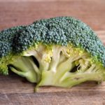 green broccoli vegetable on brown wooden table